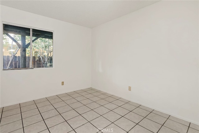 empty room with light tile patterned flooring