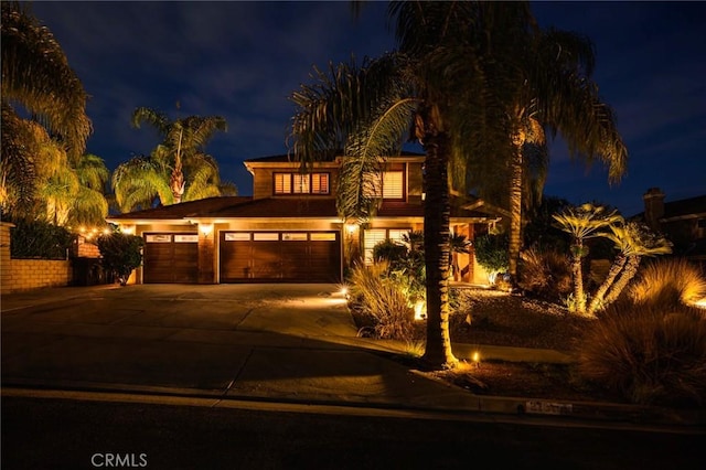 view of front of property featuring an attached garage and driveway