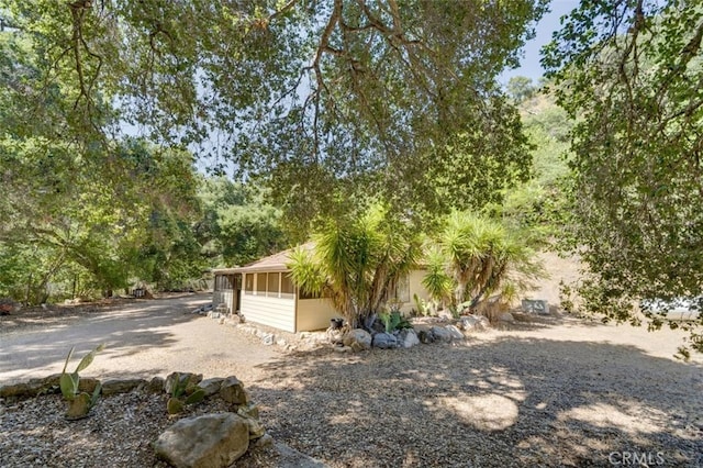 view of yard featuring a sunroom