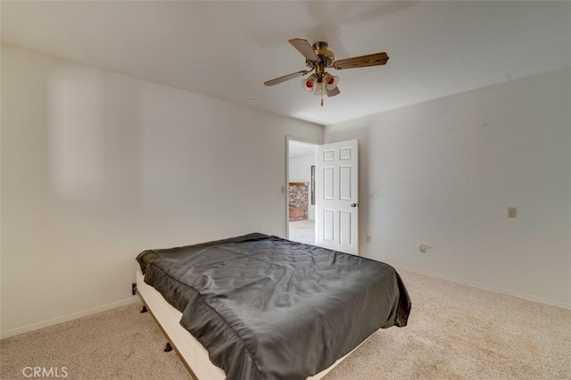 bedroom featuring ceiling fan and light carpet