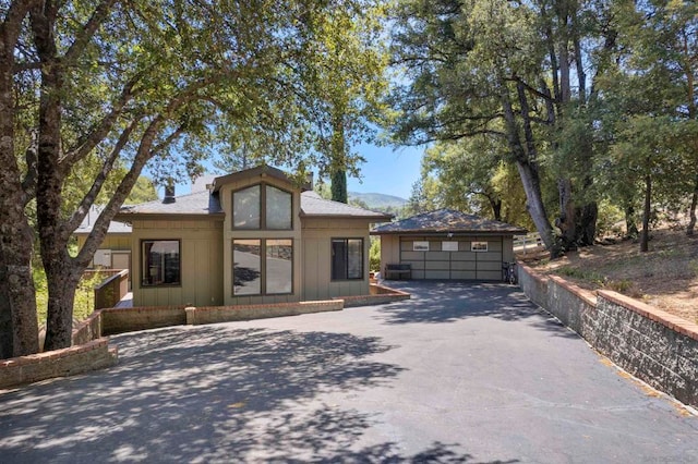 view of front facade featuring a mountain view and a garage