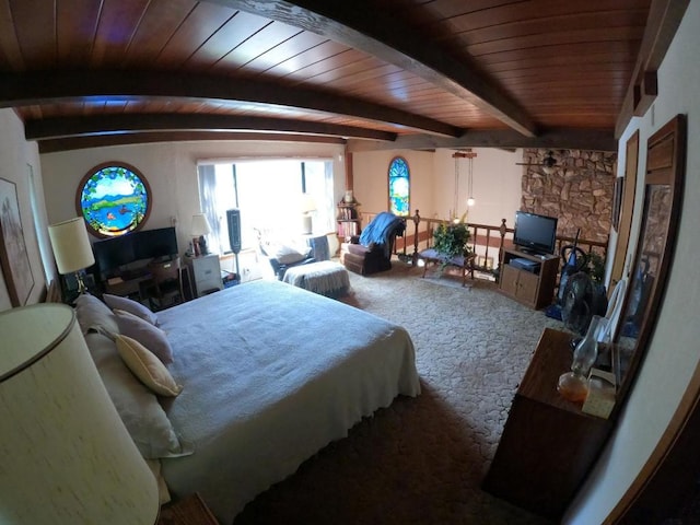 carpeted bedroom featuring vaulted ceiling with beams and wooden ceiling