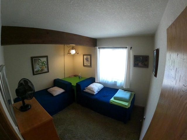 carpeted bedroom with a textured ceiling