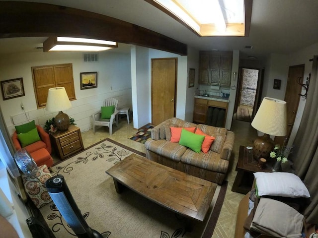 living room featuring lofted ceiling