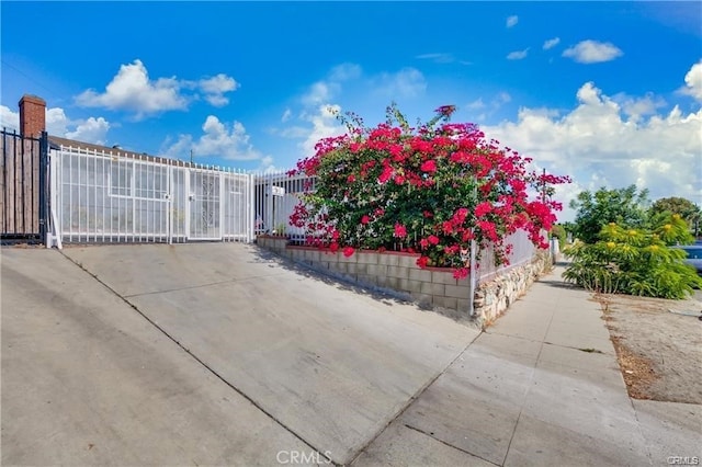 view of gate featuring fence