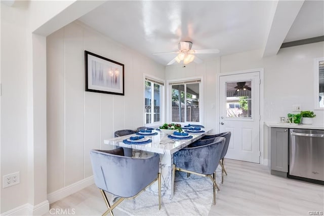 dining space featuring light wood-style floors and a ceiling fan