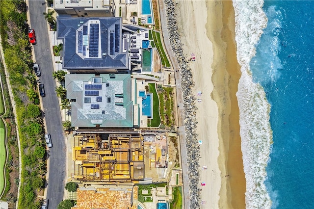 aerial view featuring a water view and a view of the beach