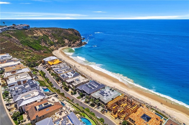 aerial view featuring a water view and a beach view