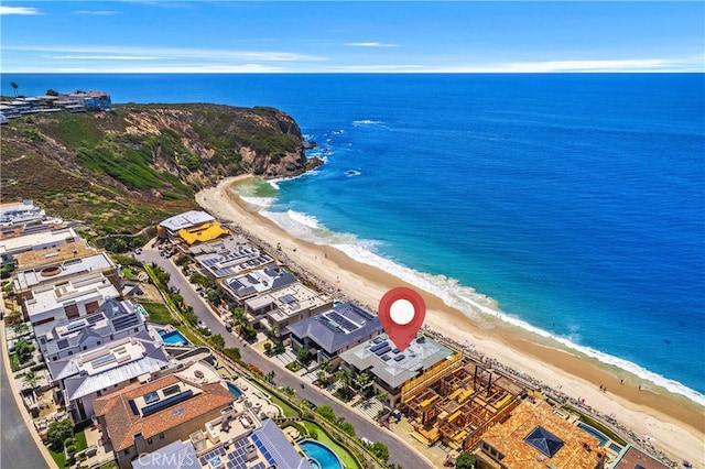 bird's eye view featuring a water view and a view of the beach