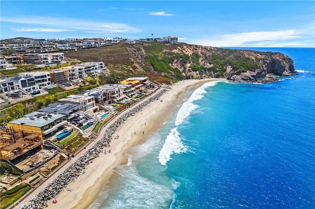 bird's eye view with a water view and a view of the beach