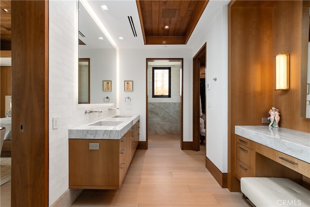 full bathroom featuring a tray ceiling, recessed lighting, wood ceiling, vanity, and wood finished floors