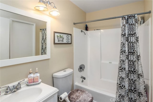 full bathroom with shower / tub combo, vanity, and toilet