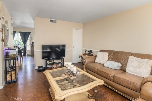 living room featuring dark wood-type flooring