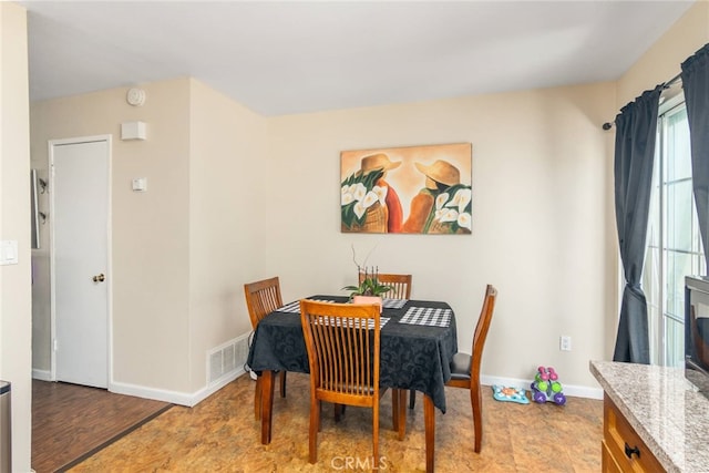 dining area featuring light wood-type flooring