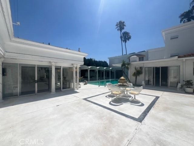 730 Santiago Ave, Long Beach, CA 90804 - view of patio / terrace featuring an outdoor pool