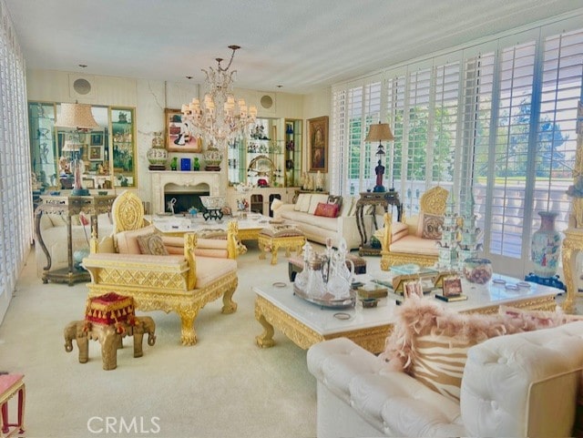 living room with carpet flooring and an inviting chandelier