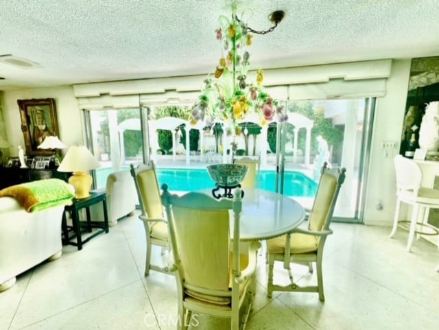 730 Santiago Ave, Long Beach, CA 90804 - dining room with a textured ceiling and healthy amount of natural light