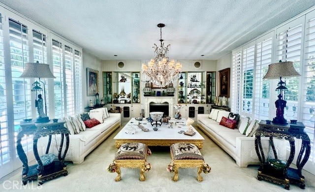 730 Santiago Ave, Long Beach, CA 90804 - living room featuring a chandelier, a textured ceiling, and a fireplace