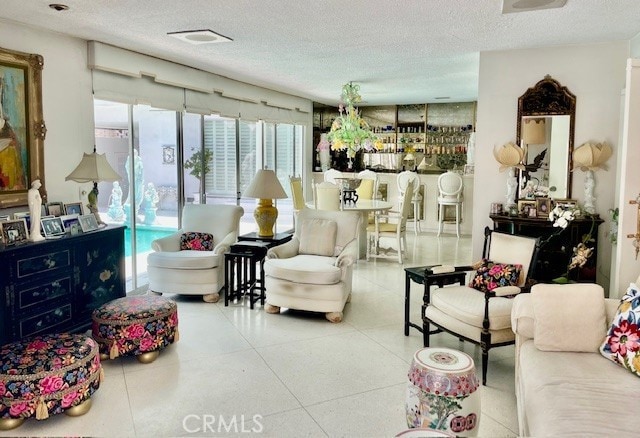 730 Santiago Ave, Long Beach, CA 90804 - living area featuring a textured ceiling and tile patterned flooring