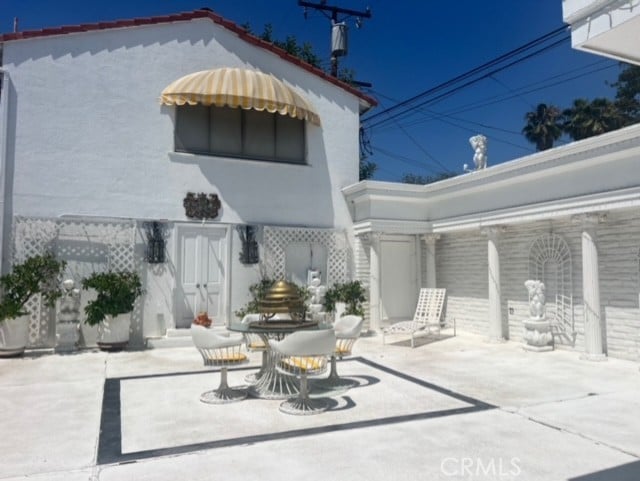 730 Santiago Ave, Long Beach, CA 90804 - back of house with a patio area and stucco siding