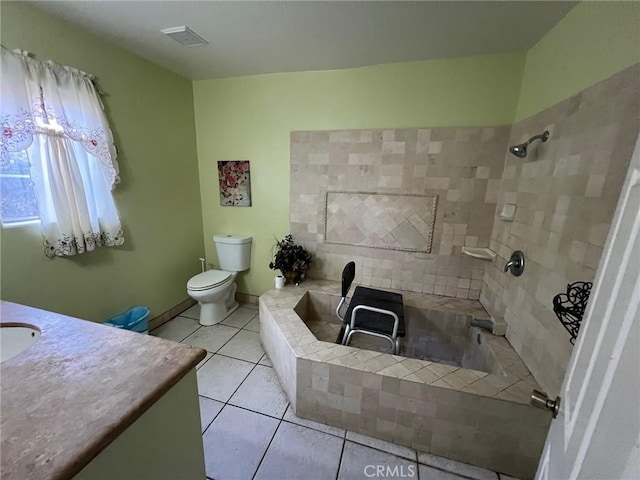 bathroom featuring tile patterned floors, vanity, and toilet