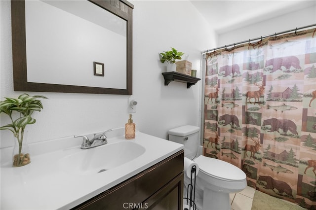 bathroom featuring toilet, curtained shower, vanity, and tile patterned floors