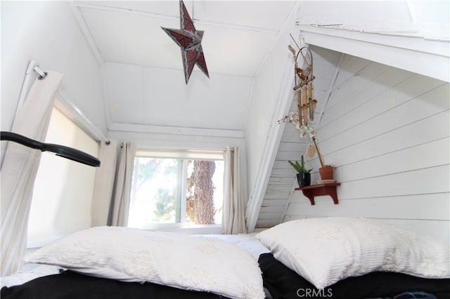 bedroom featuring lofted ceiling