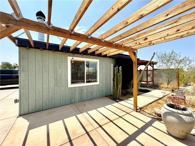 wooden deck featuring a patio area and a pergola