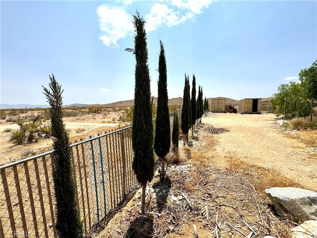 view of yard with a rural view