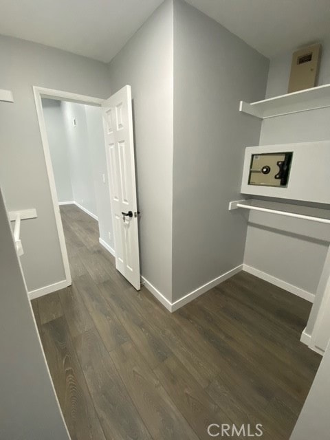 hallway featuring dark wood-type flooring