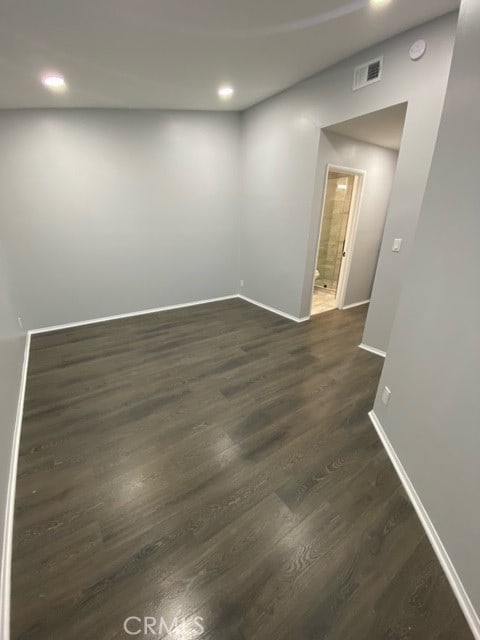 unfurnished room featuring dark hardwood / wood-style floors