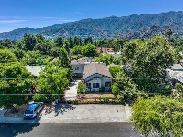 birds eye view of property with a mountain view