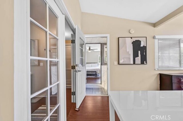 hall with dark wood finished floors and french doors