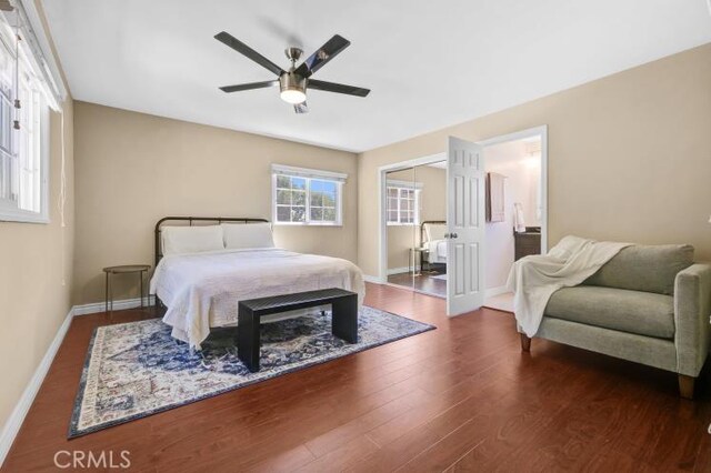 bedroom featuring a ceiling fan, wood finished floors, and baseboards