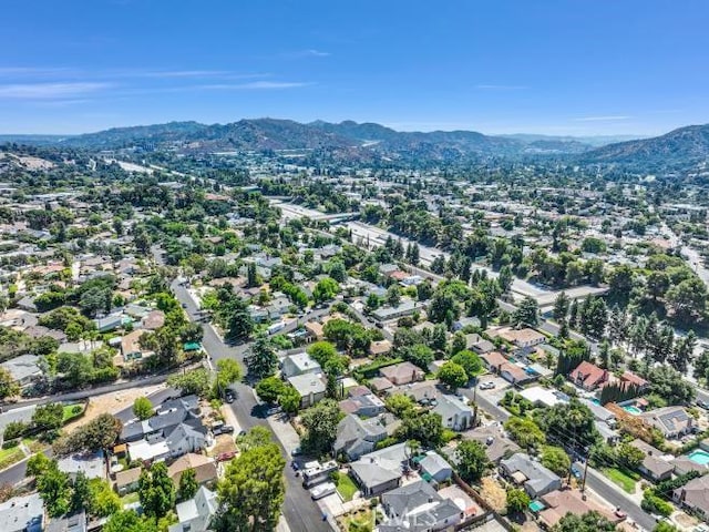 birds eye view of property featuring a mountain view and a residential view