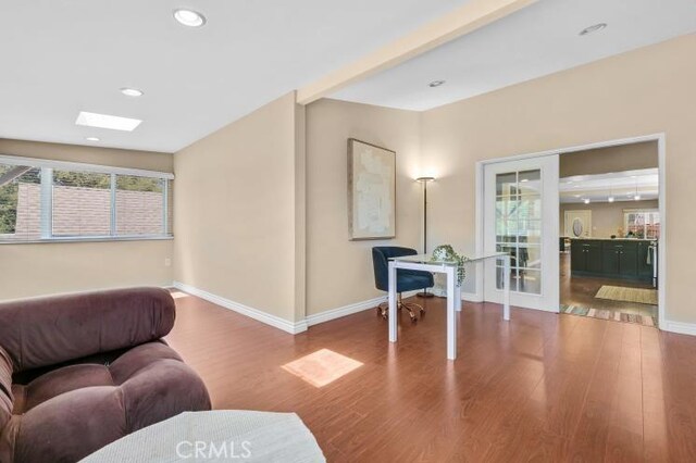 sitting room featuring recessed lighting, wood finished floors, and baseboards