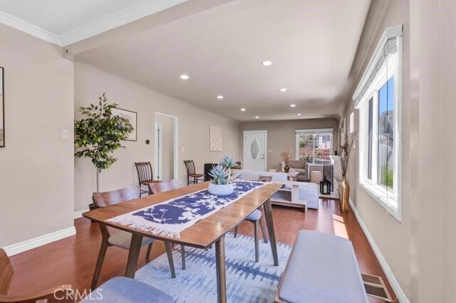 dining space with recessed lighting, visible vents, baseboards, and wood finished floors