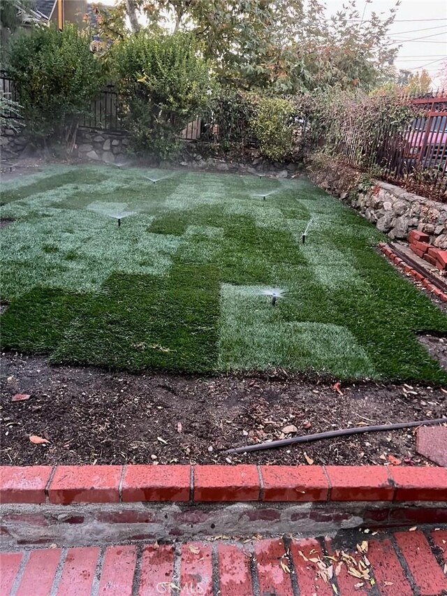 view of yard with fence