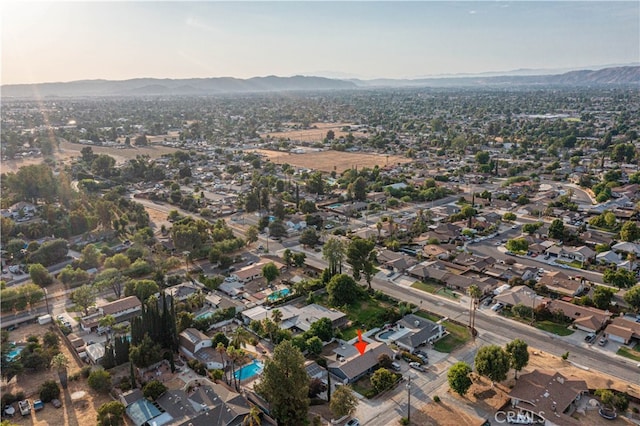 birds eye view of property with a mountain view