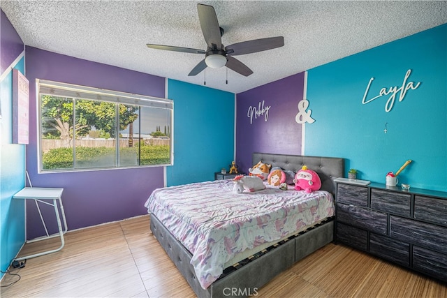 bedroom featuring a textured ceiling and ceiling fan