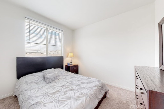 bedroom with light colored carpet