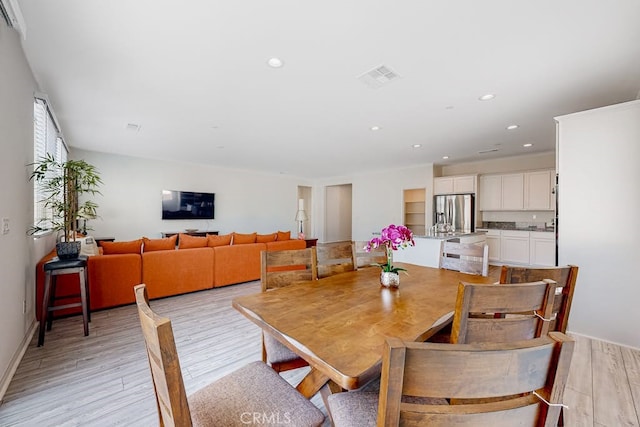 dining room with light hardwood / wood-style floors