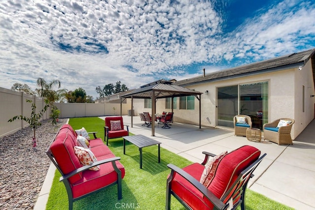 view of patio with outdoor lounge area and a gazebo