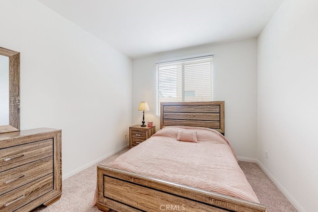 bedroom with light colored carpet