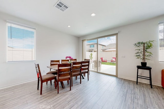 dining area featuring light wood-type flooring