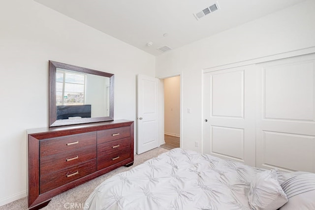 carpeted bedroom featuring a closet