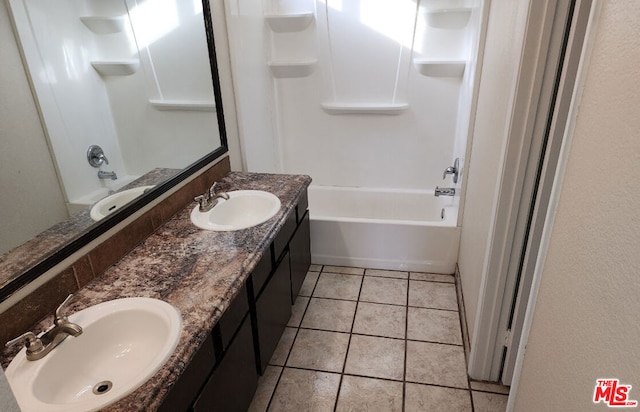 bathroom with tile patterned floors, vanity, and bathing tub / shower combination