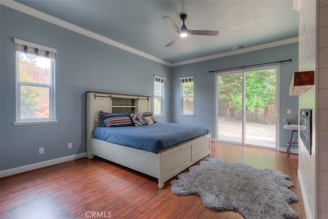 bedroom with ceiling fan, access to exterior, crown molding, and hardwood / wood-style floors