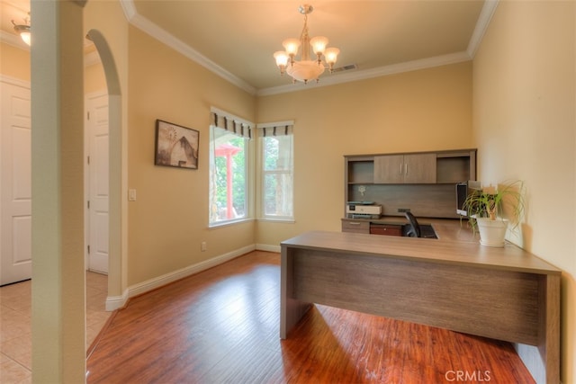 office with light hardwood / wood-style flooring, a chandelier, and ornamental molding