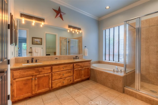 bathroom featuring shower with separate bathtub, vanity, and a healthy amount of sunlight